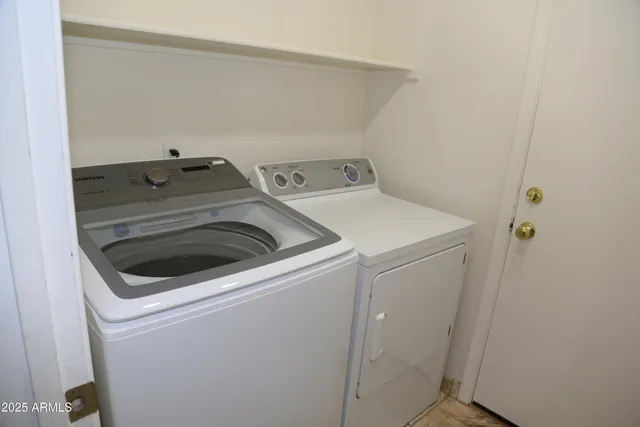 a utility room with dryer and washer