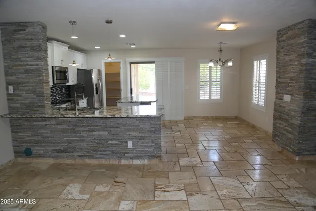 a view of entryway with kitchen