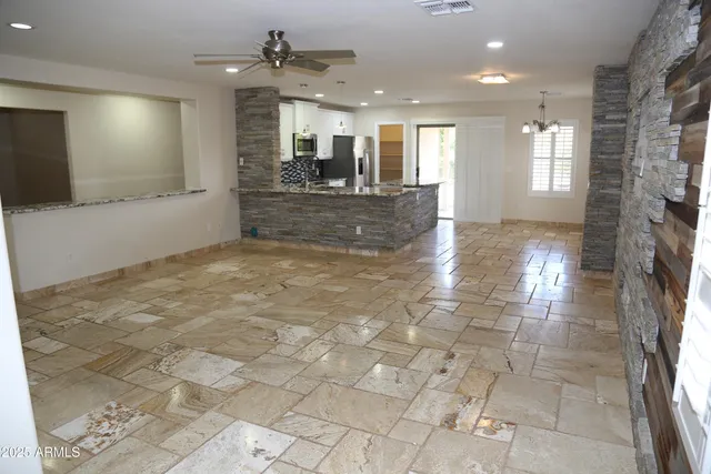 a view of entryway and kitchen