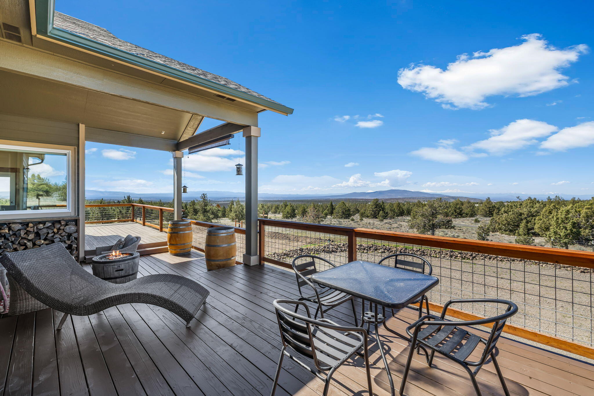 6040 Gravett Road Prineville, OR 97754 - Photo 43 of 77 a view of a roof deck with chair and wooden floor