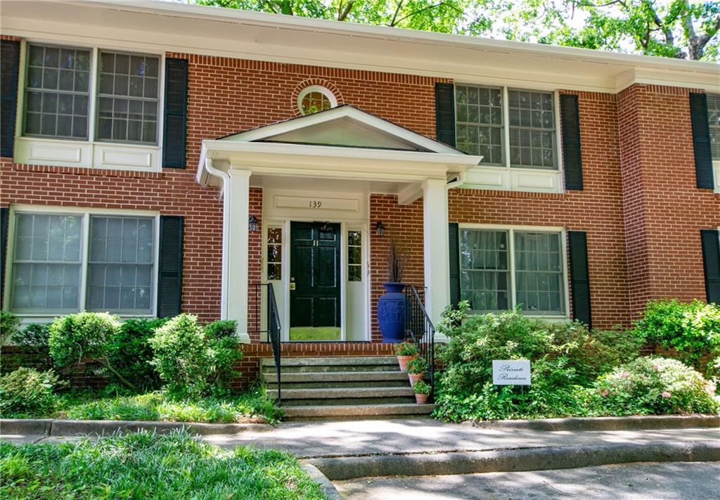 139 East Hill Street Decatur, GA 30030 - Photo 15 of 15 a view of a brick house with a yard plants and large tree