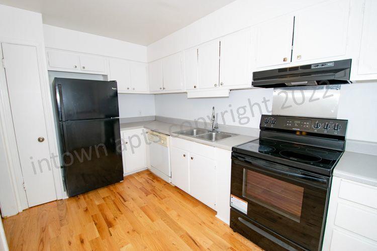 139 East Hill Street Decatur, GA 30030 - Photo 3 of 15 a kitchen with a stove and a refrigerator