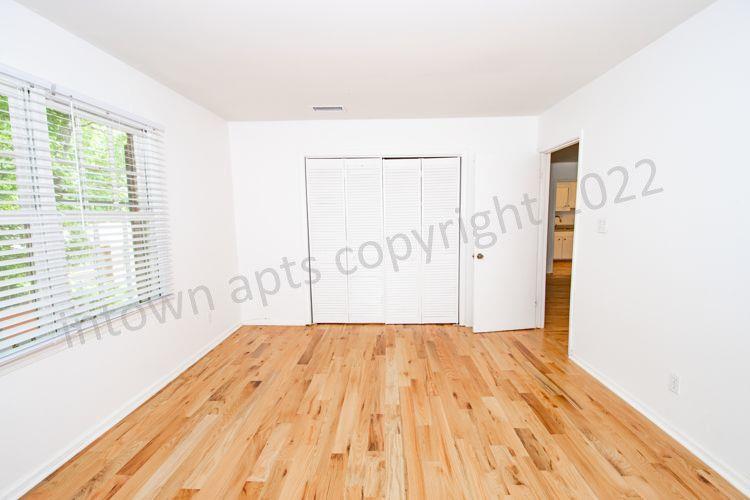 139 East Hill Street Decatur, GA 30030 - Photo 10 of 15 a view of a room with wooden floor and white walls