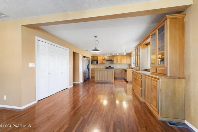 a view of a kitchen with wooden floor