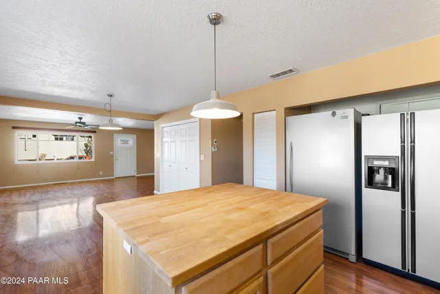 a room with a bed and a chandelier