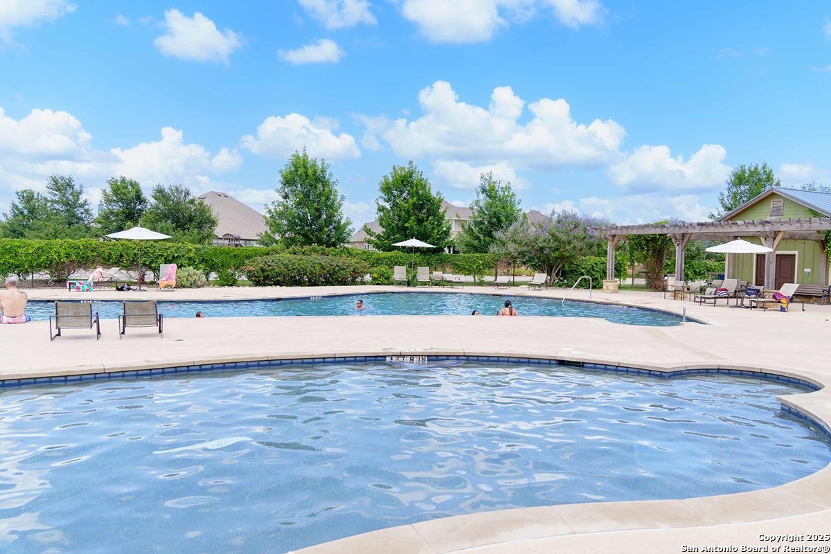 12110 Secret Vine Schertz, TX 78154 - Photo 5 of 7 a view of an swimming pool and an outdoor space