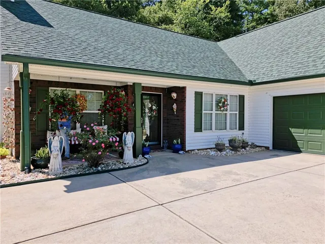a living room with furniture ceiling fan and a rug