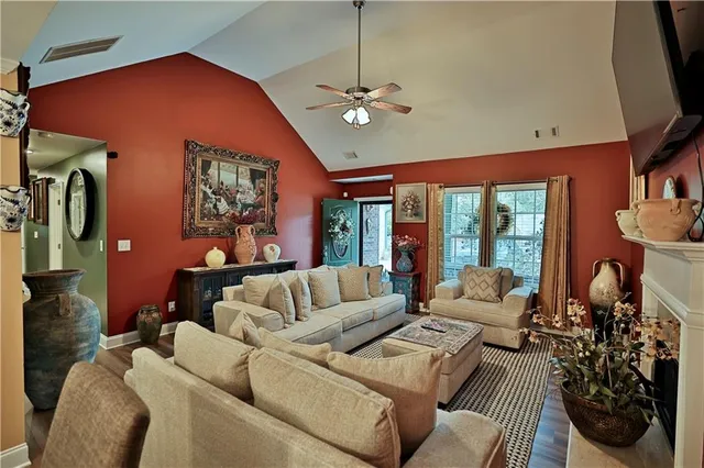 a bedroom with a bed and a dresser in it