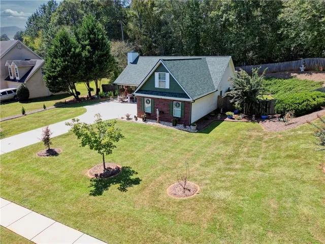 a front view of a house with a yard