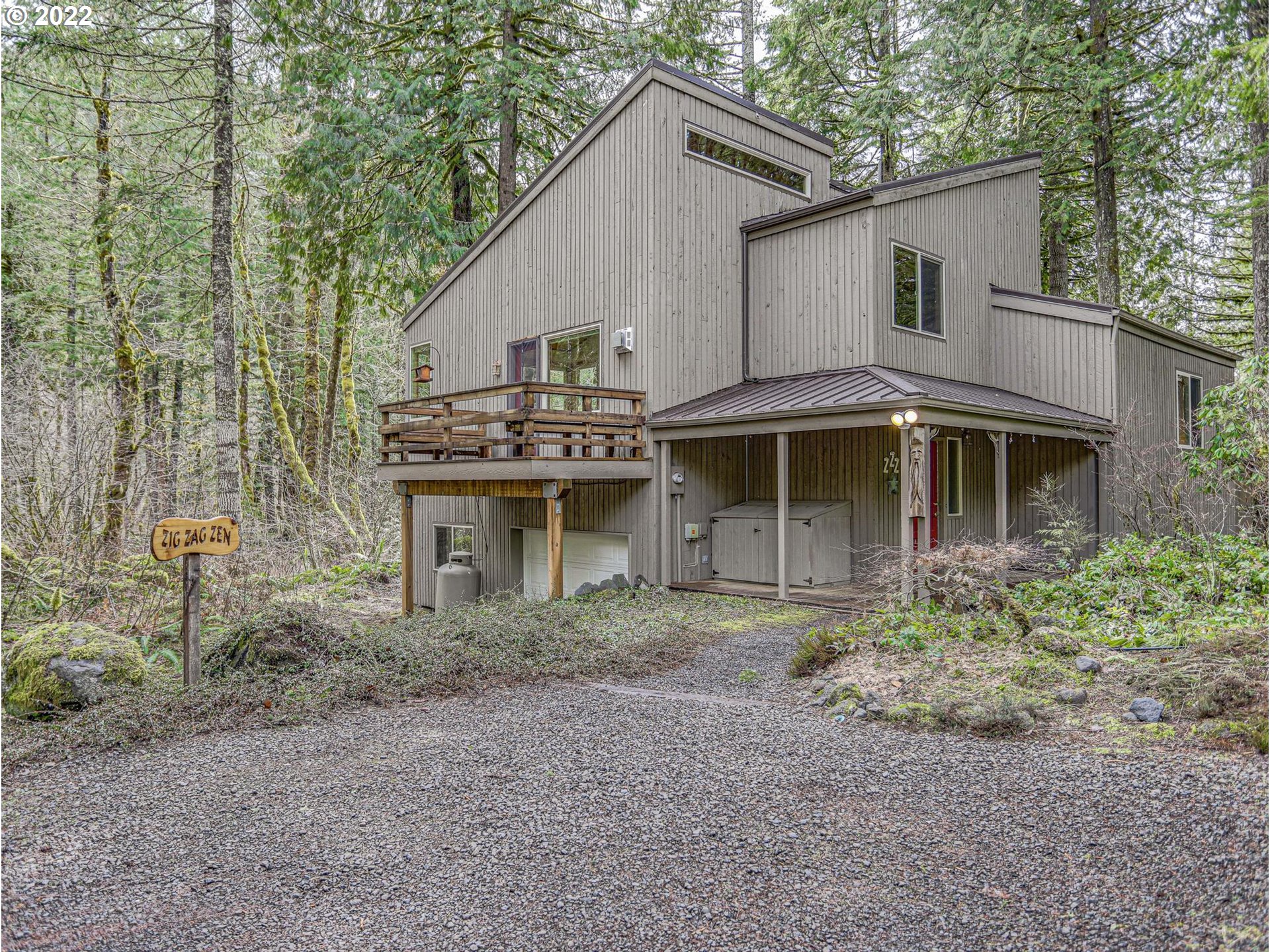 73000 East Village Loop Road Rhododendron, OR 97049 - Photo 1 of 32 a view of a yard in front of house