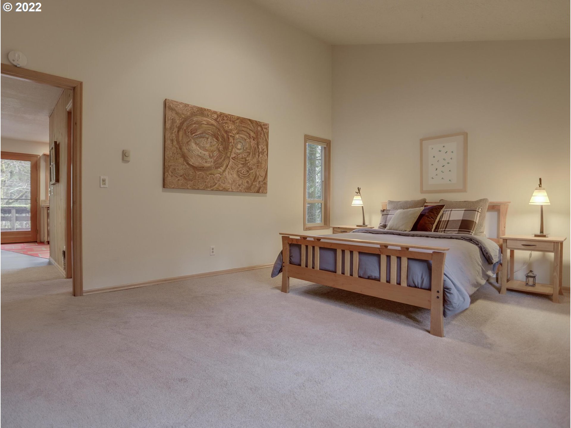 73000 East Village Loop Road Rhododendron, OR 97049 - Photo 18 of 32 a bedroom with a bed and a painting on the wall