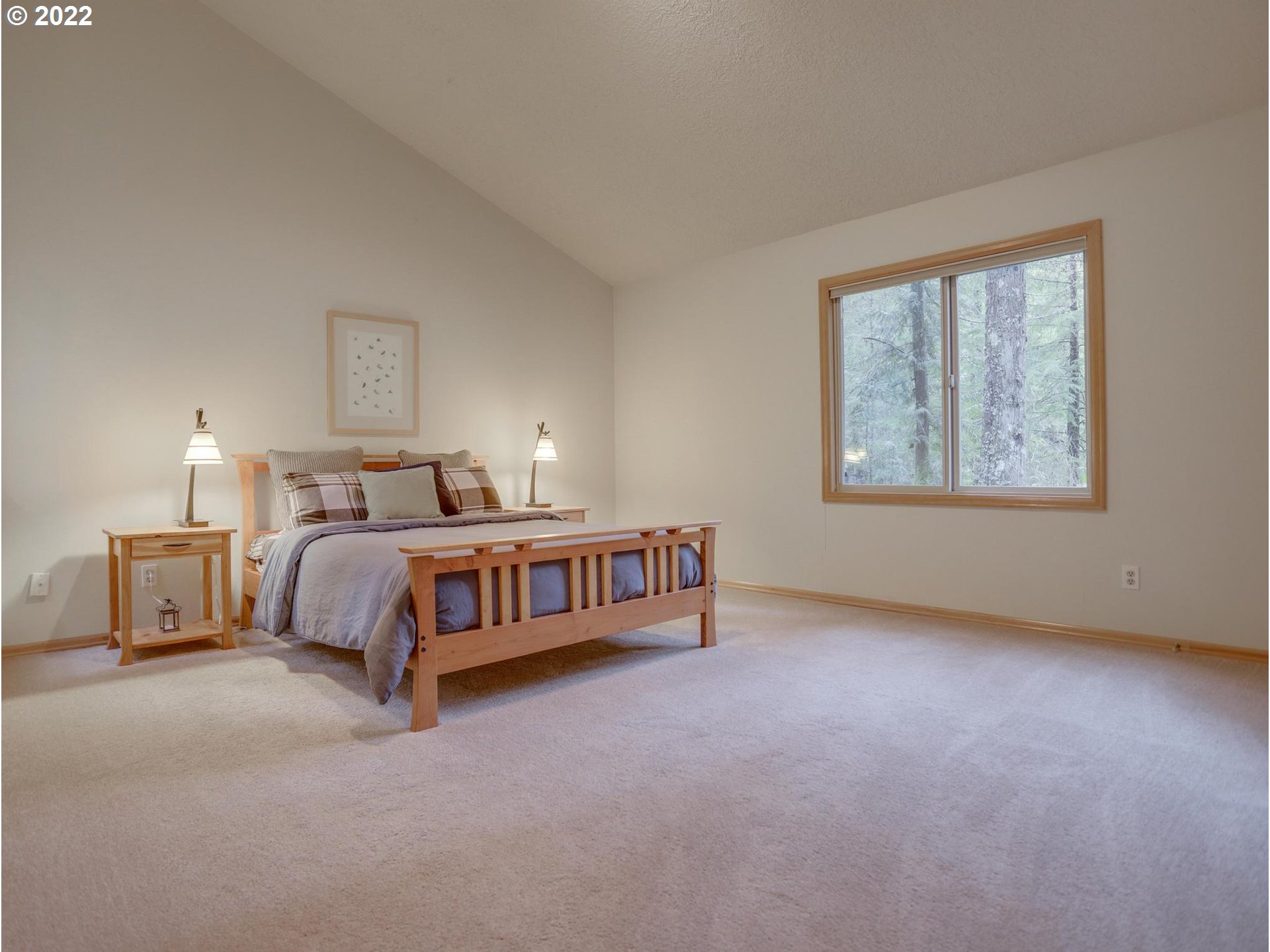 73000 East Village Loop Road Rhododendron, OR 97049 - Photo 21 of 32 a bedroom with a bed next to a window