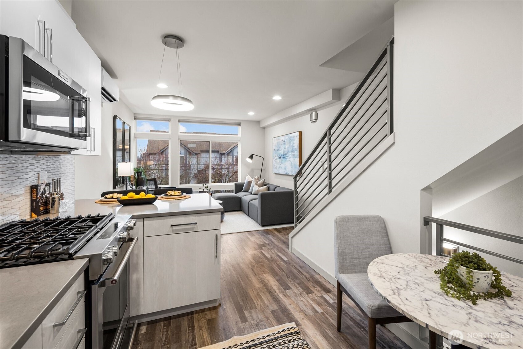 728 North 43rd Street Seattle, WA 98103 - Photo 11 of 29 a kitchen that has a table and chairs in it
