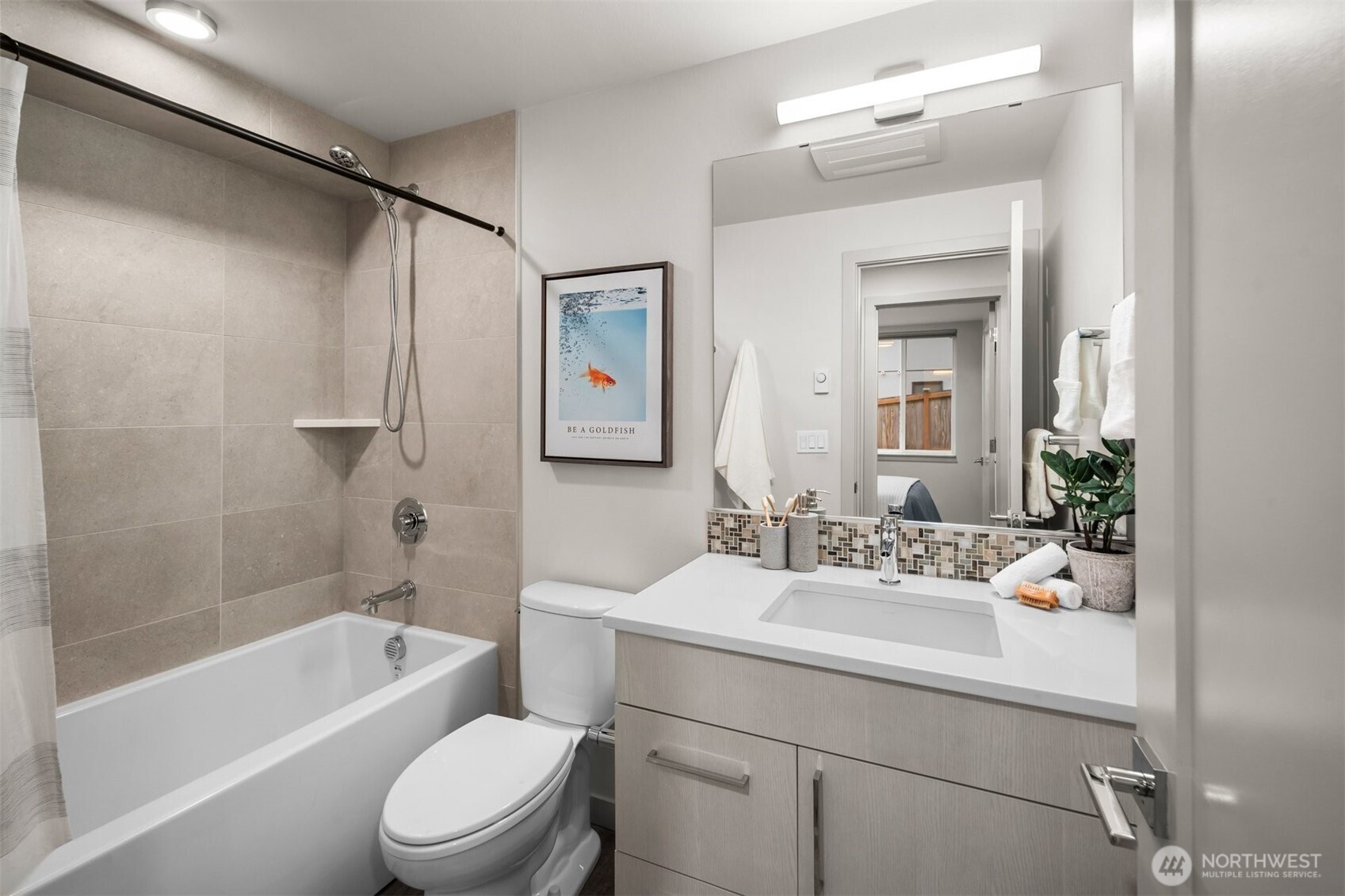 728 North 43rd Street Seattle, WA 98103 - Photo 13 of 29 a bathroom with a sink toilet and shower