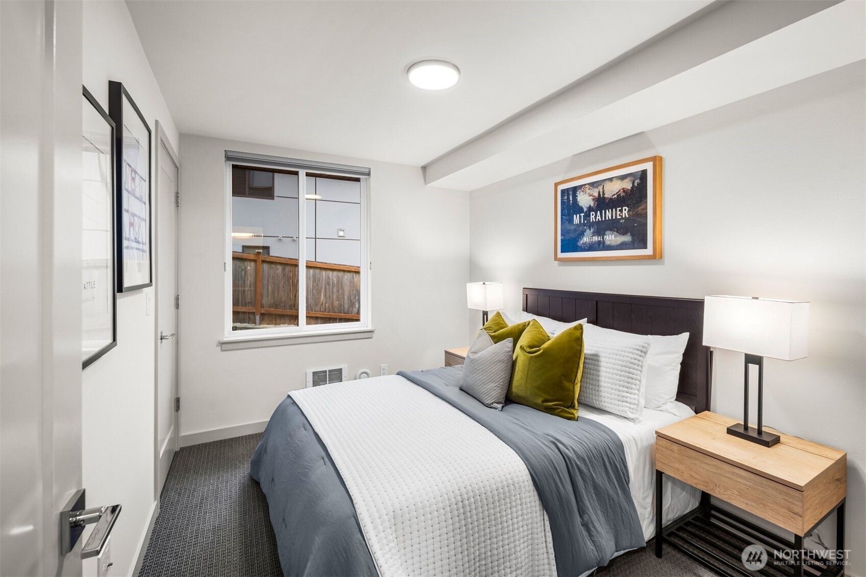 728 North 43rd Street Seattle, WA 98103 - Photo 14 of 29 a bedroom with a bed and a window