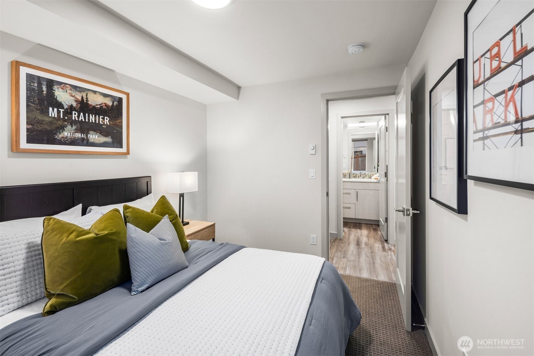 728 North 43rd Street Seattle, WA 98103 - Photo 15 of 29 a bedroom with a bed and a painting on the wall