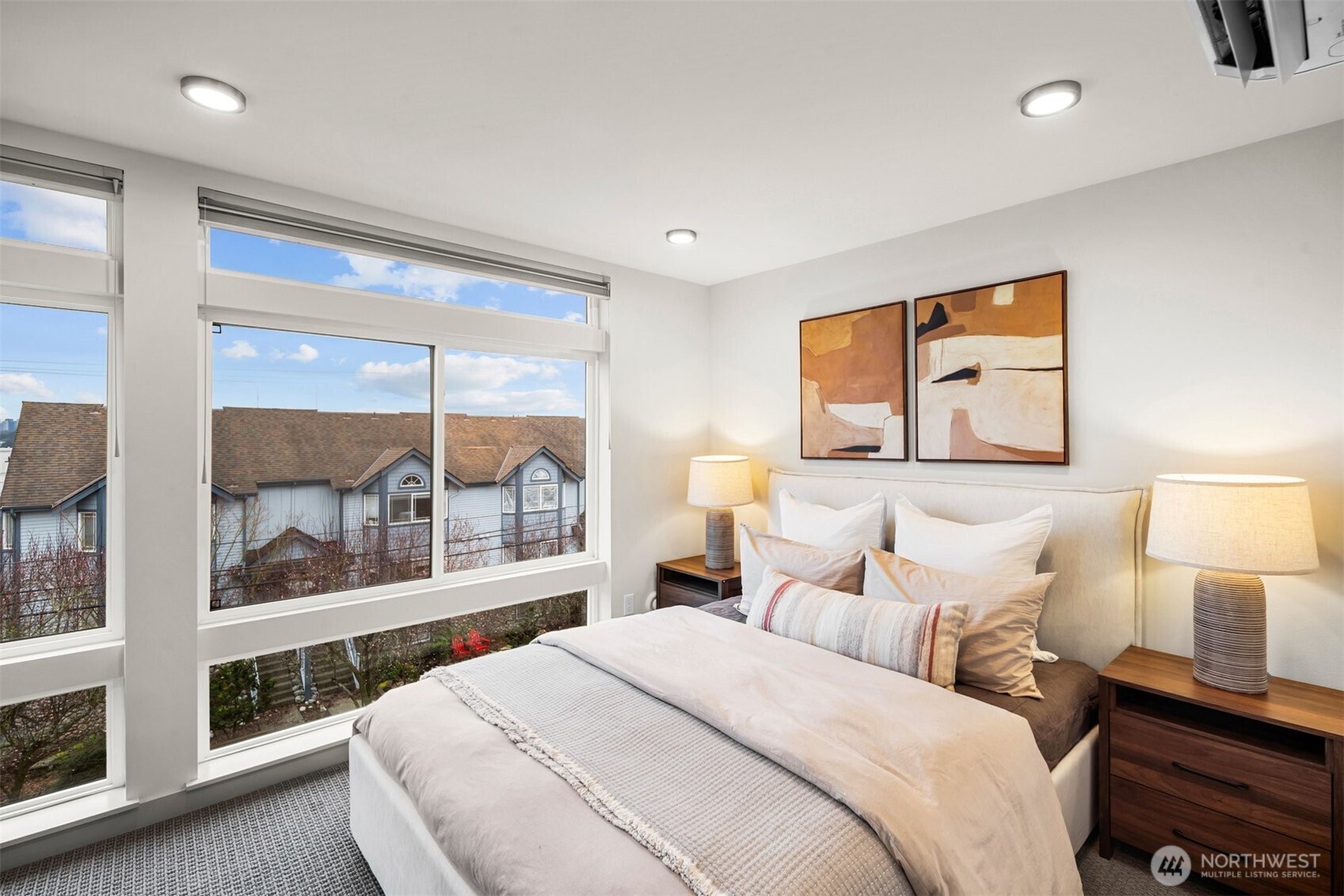 728 North 43rd Street Seattle, WA 98103 - Photo 16 of 29 a bedroom with a large bed and a large window