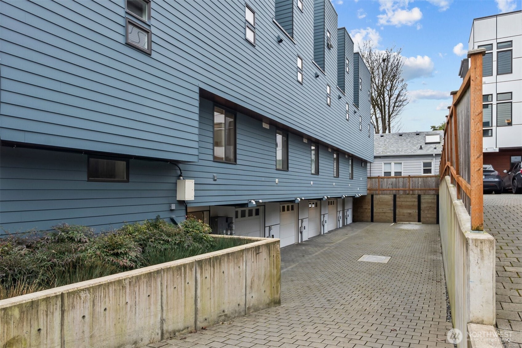 728 North 43rd Street Seattle, WA 98103 - Photo 20 of 29 a view of a house with wooden fence