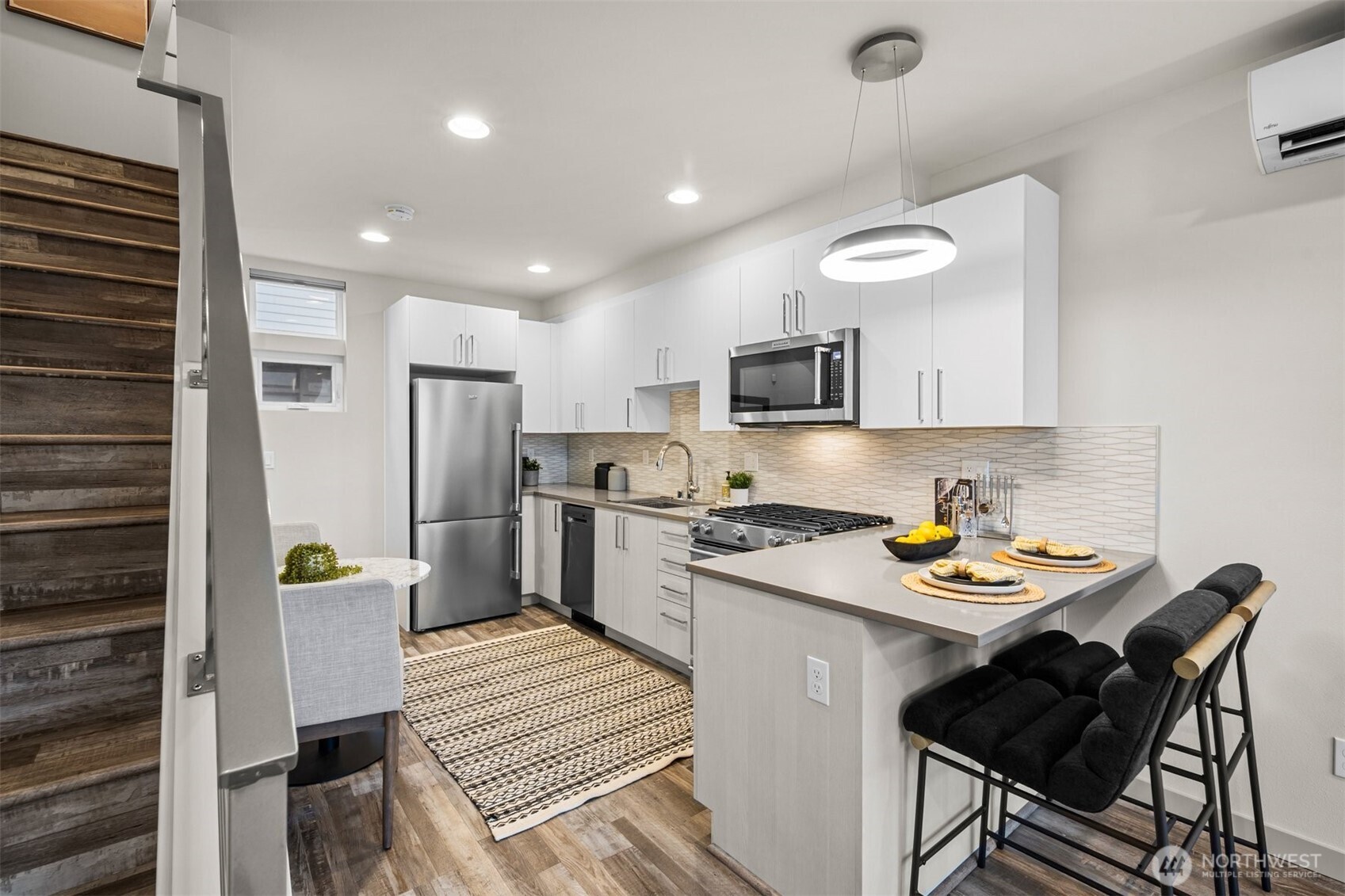 728 North 43rd Street Seattle, WA 98103 - Photo 10 of 29 a kitchen with a refrigerator and a stove top oven