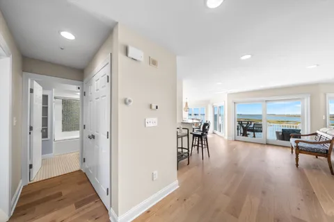 a bathroom with a granite countertop sink a toilet and shower