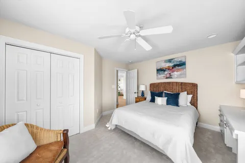 a view of a balcony with wooden floor and fence