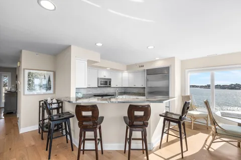 a kitchen with a table and chairs in it