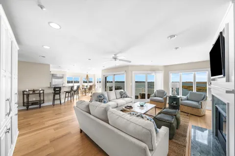 a living room with fireplace furniture and a flat screen tv