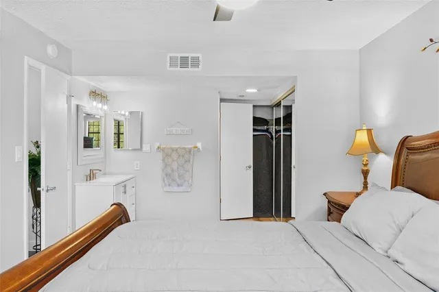 a bedroom with furniture and wooden floor