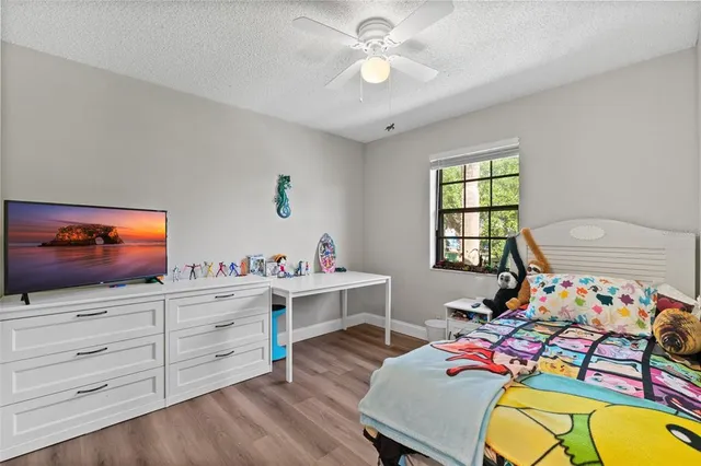 a view of a workspace with furniture and a flat screen tv