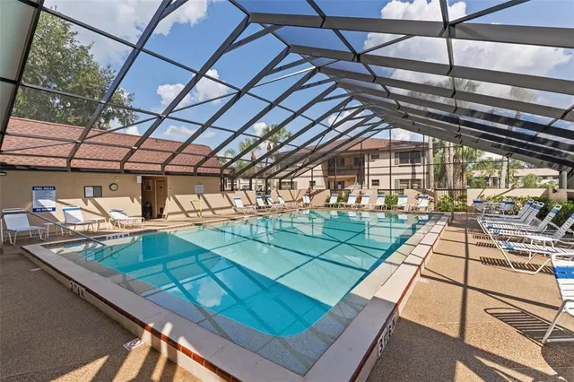 a room with lots of chairs and large windows