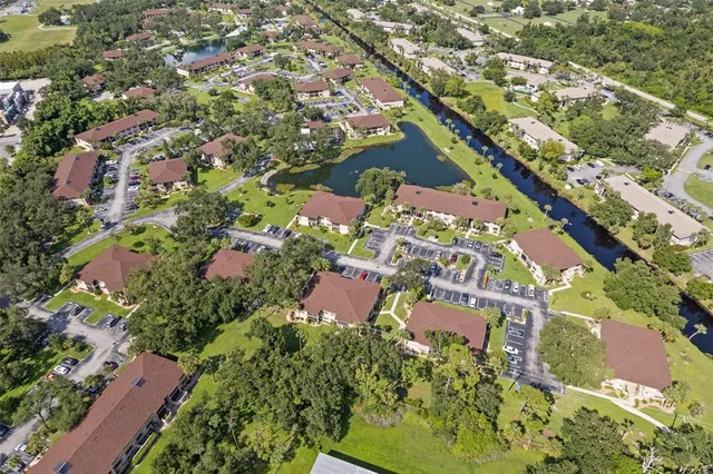 an aerial view of a house with a lake view