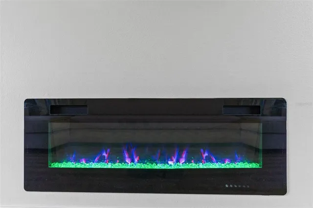 a view of room with a fireplace