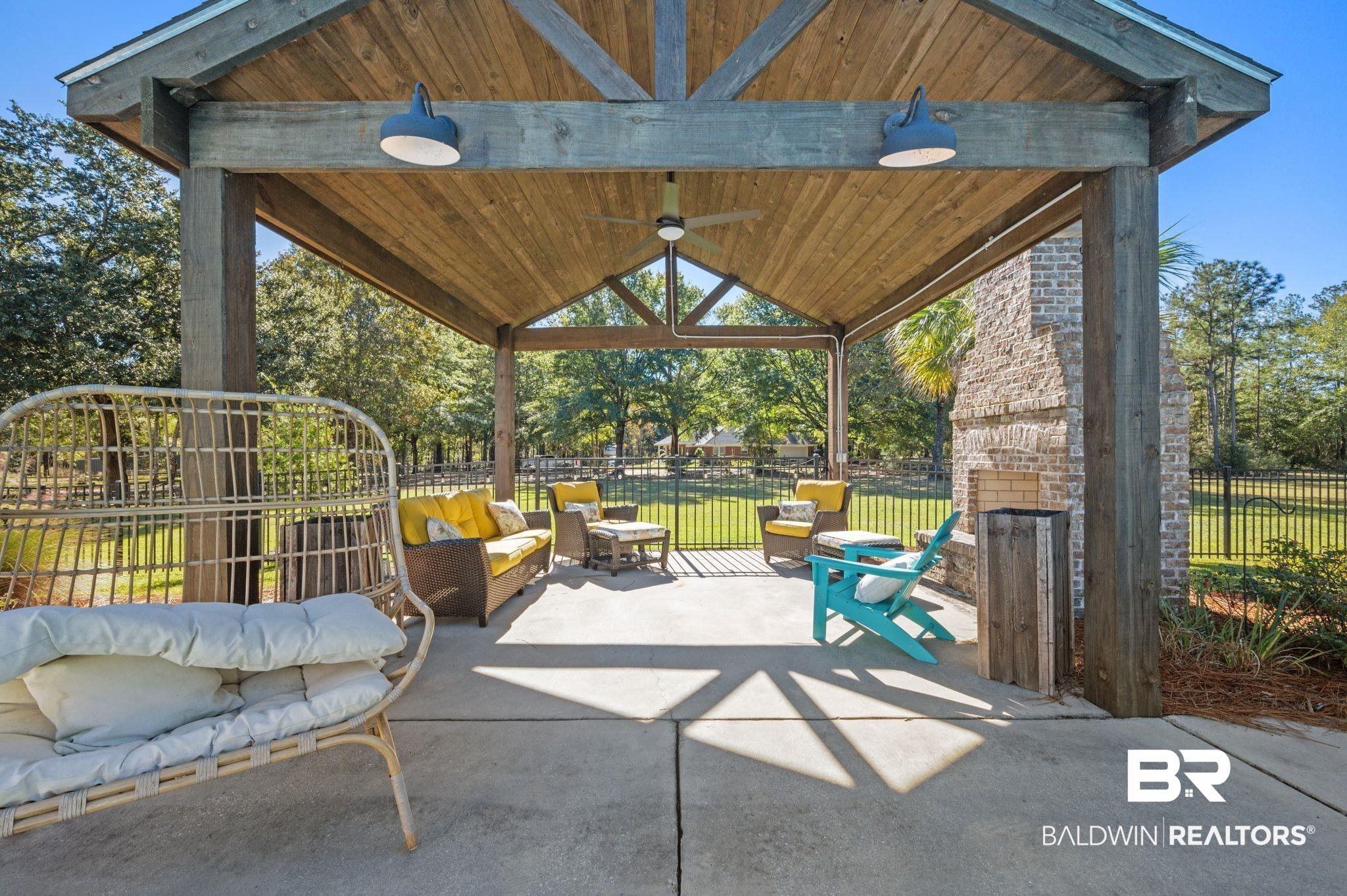 38211-d) V R Byrd Road Bay Minette, AL 36507 - Photo 33 of 58 View of patio / terrace featuring an outdoor stone fireplace, ceiling fan, and a gazebo