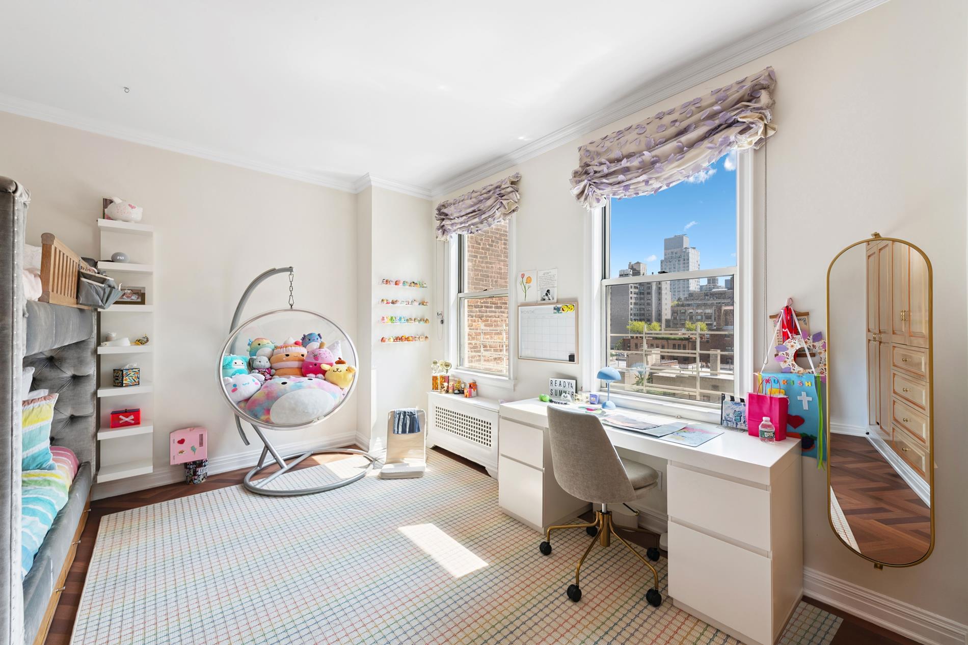 330 East 72nd Street, Unit 9/10 Manhattan, NY 10021 - Photo 11 of 17 a living room with furniture a rug and a flat screen tv