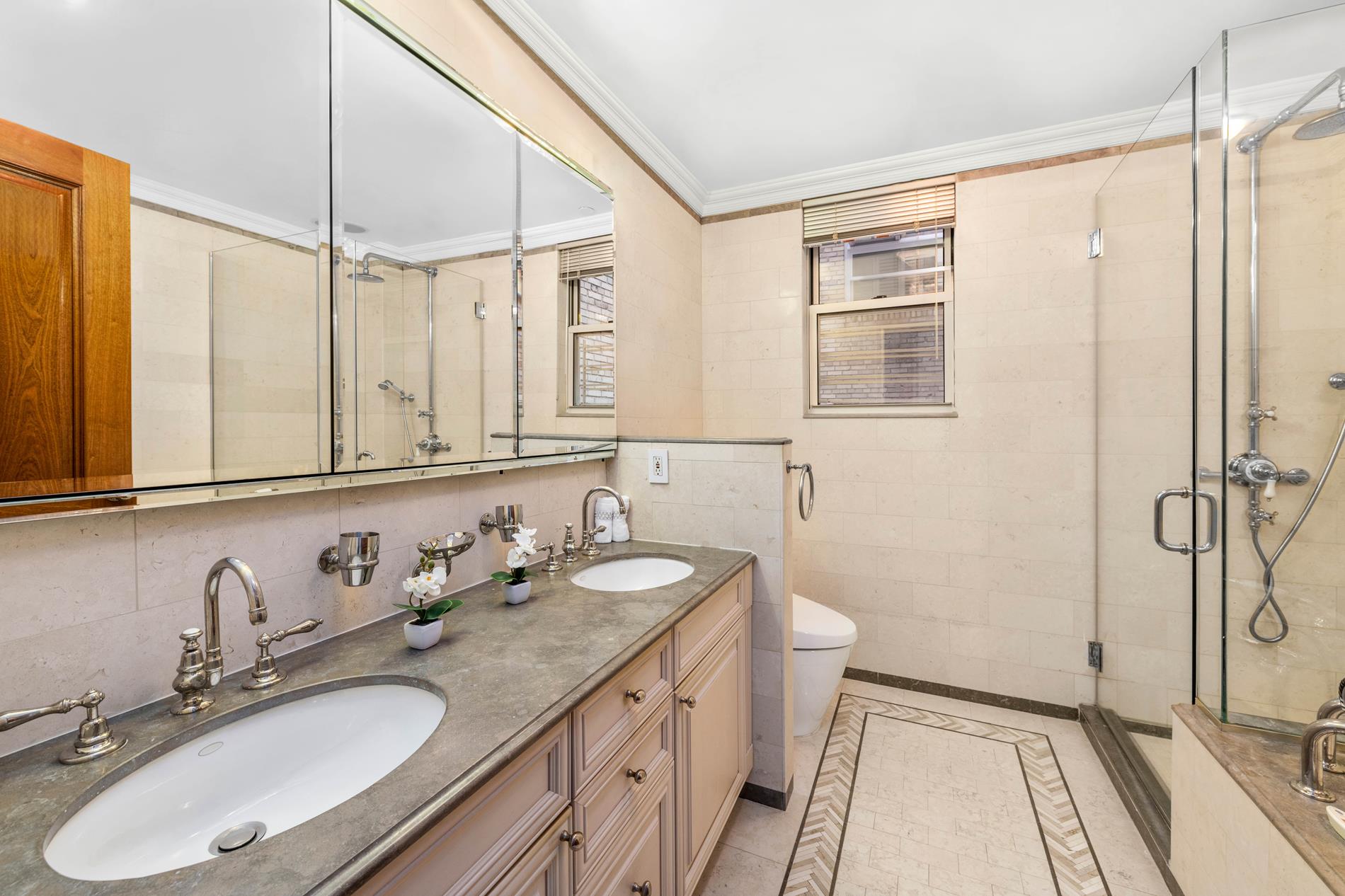 330 East 72nd Street, Unit 9/10 Manhattan, NY 10021 - Photo 6 of 17 a bathroom with a sink double vanity and a mirror