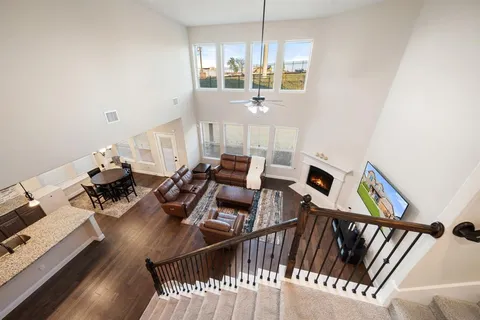 a view of a dining room with furniture wooden floor and chandelier