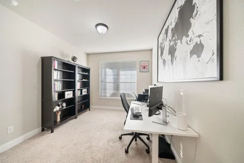 a workspace with furniture and window