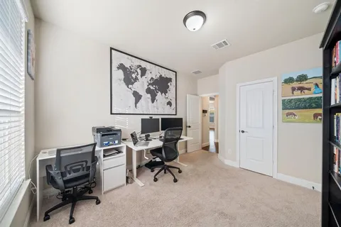 a view of a workspace with furniture