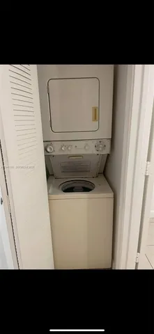 a view of a swimming pool with lawn chairs