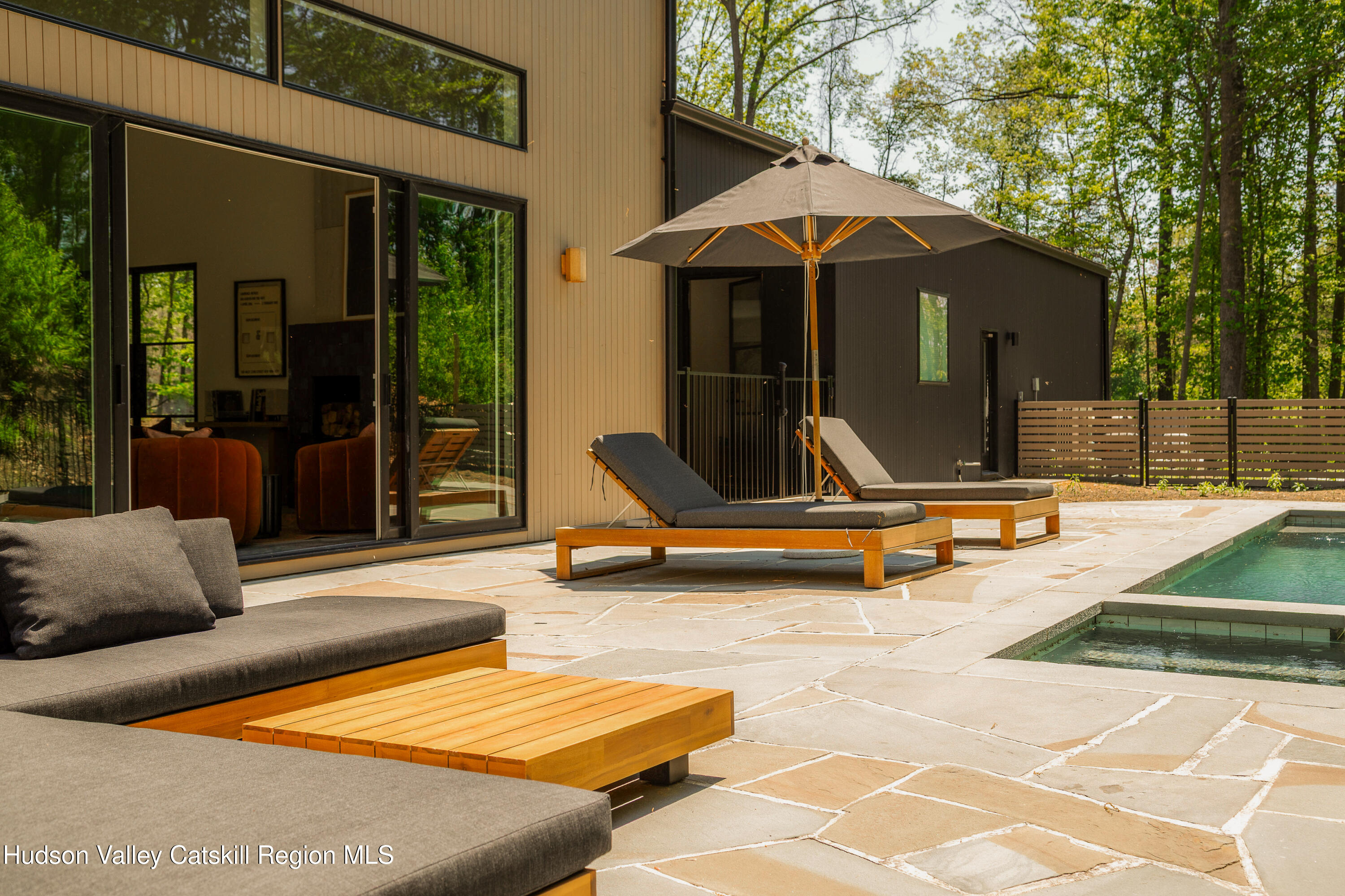 54 Langridge Road Tivoli, NY 12583 - Photo 22 of 40 a view of a patio with a table and chairs under an umbrella
