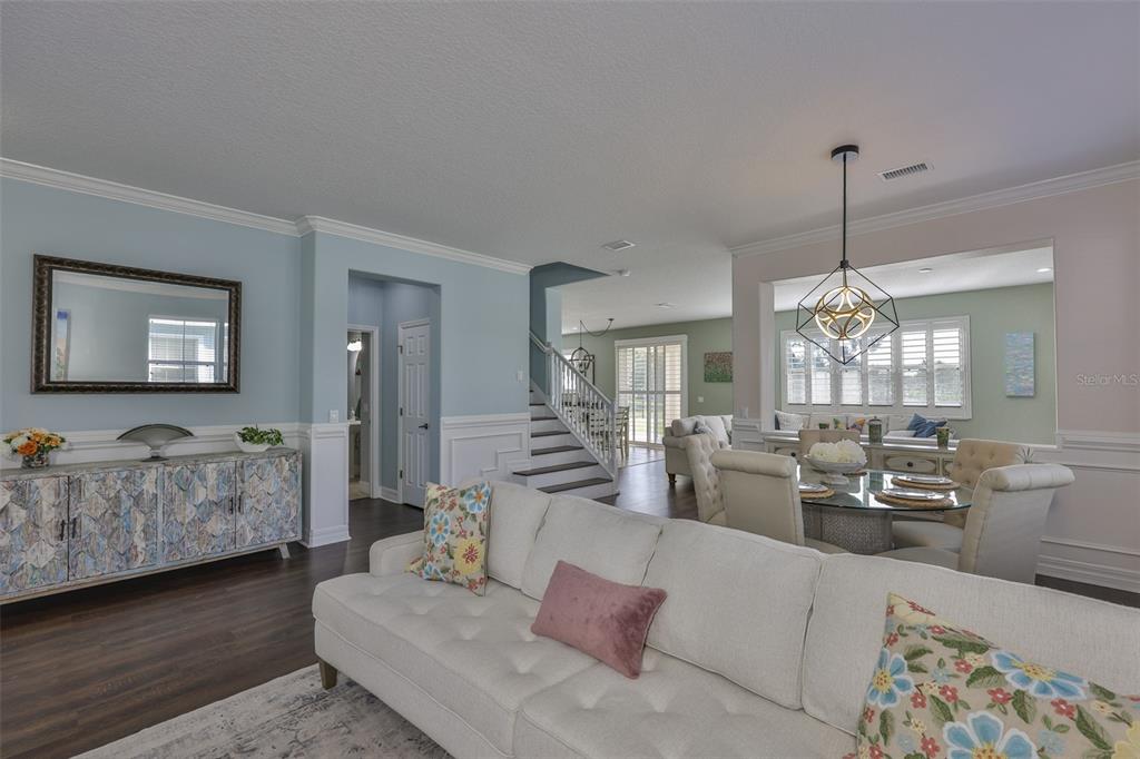5409 Hammock View Lane Apollo Beach, FL 33572 - Photo 17 of 68 a living room with furniture and wooden floor