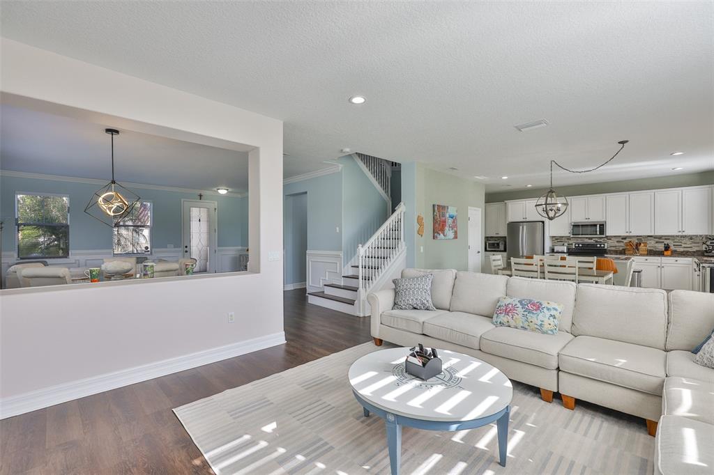 5409 Hammock View Lane Apollo Beach, FL 33572 - Photo 20 of 68 a living room with furniture kitchen and a dining table