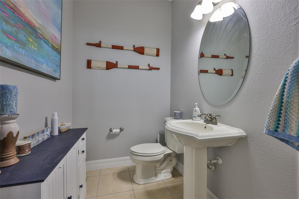 5409 Hammock View Lane Apollo Beach, FL 33572 - Photo 22 of 68 a bathroom with a toilet sink and mirror