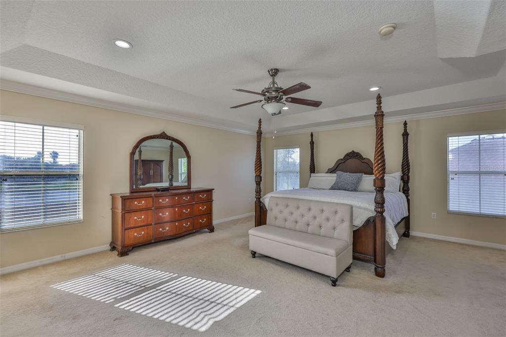 5409 Hammock View Lane Apollo Beach, FL 33572 - Photo 27 of 68 a bedroom with a bed and a dresser