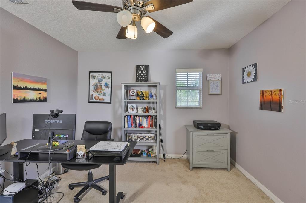 5409 Hammock View Lane Apollo Beach, FL 33572 - Photo 33 of 68 a view of a workspace with lounge chair and a window