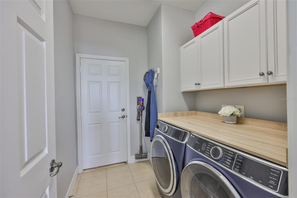 5409 Hammock View Lane Apollo Beach, FL 33572 - Photo 39 of 68 a utility room with dryer and washer