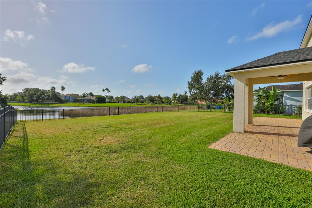 5409 Hammock View Lane Apollo Beach, FL 33572 - Photo 46 of 68 a view of a lake with a big yard