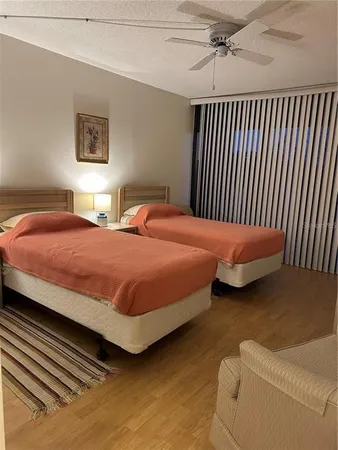 a bedroom with a bed and a chair