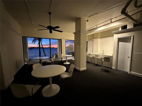 a view of a livingroom with furniture and a window