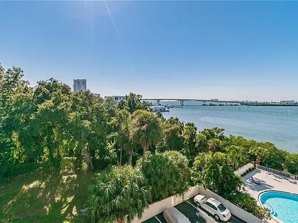 a view of a lake with houses in the back